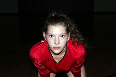 Madison Brown poses for a portrait in the volleyball gym at Braswell High. Brown, 15, is the libero for the varsity volleyball team.