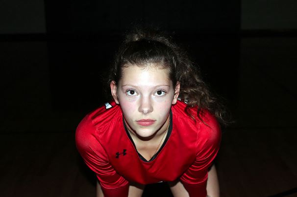 Madison+Brown+poses+for+a+portrait+in+the+volleyball+gym+at+Braswell+High.+Brown%2C+15%2C+is+the+libero+for+the+varsity+volleyball+team.