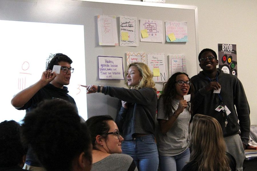 Eyeri Casillas, Sydney Shaver, Kache Parker and Emmanuel Aryee play “Machine à écrire” or “typewriter” in French I as part of a review.
