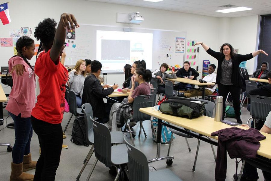 ASL teacher Shannon Campbell instructs students in how to communicate using their whole body. The lesson turned into a game for the class.