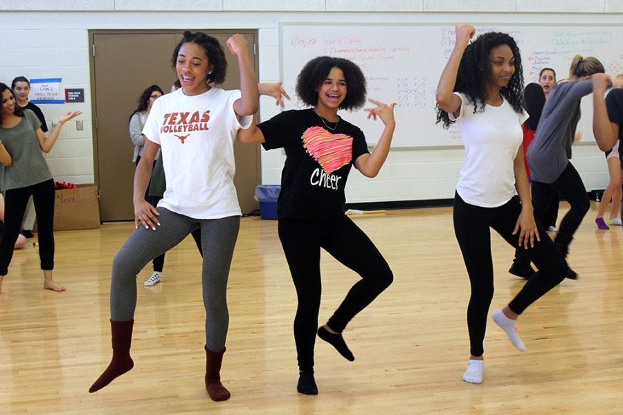 Chasity Hooker, Djade Allen and Starr Jackson practice American social dances in Kristina Shelburne's class as part of a world dance unit. Students learned dances such as the Electric Slide and Cotton-Eye Joe.