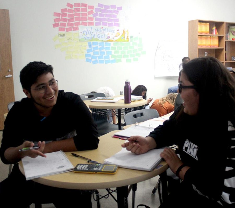 Eric Escobar and Anai Jimenez discuss math problems in Ashley Joanidis pre-AP pre-calculus class on Aug. 24. School began in Denton ISD on Aug. 16 due to the districts status as a District of Innovation.