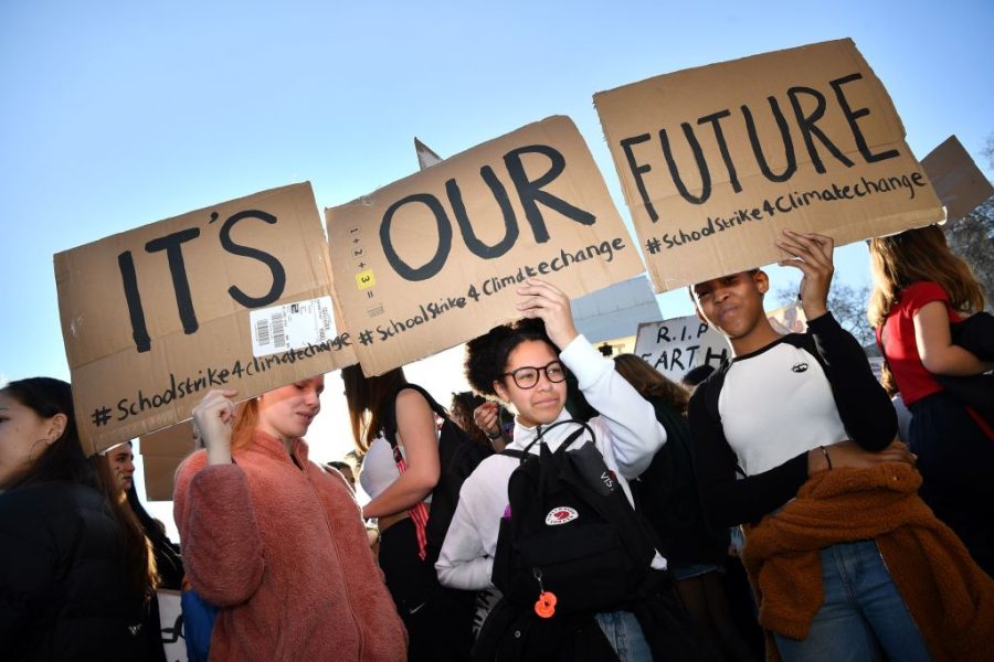 Young demonstrators hold placards as they attend a climate change protest organised by Youth Strike 4 Climate, opposite the Houses of Parliament in central London on February 15, 2019. - Hundreds of young people took to the streets to demonstrate Friday, with some of them having gone on strike from school, as part of a global youth action over climate change. (Photo by Ben STANSALL / AFP)        (Photo credit should read BEN STANSALL/AFP/Getty Images)