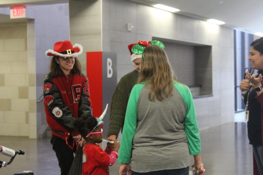 At the end of the period, students pack up toys and help take them down to the truck that would take the toys back to the younger students’ school for them to take home. 