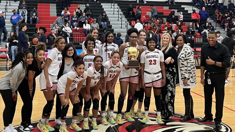 Braswell's Varsity Girls Basketball poses together Tuesday, February 8 after they were awarded the 5-6A District Champions.