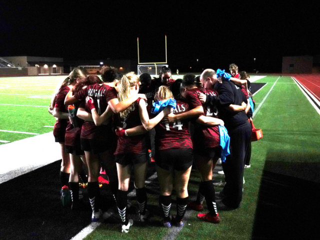 Coach+Jeff+Miller+huddles+up+with+the+2022-23+girls+varsity+soccer+team.+Photo+Courtesy+of+The+Ambush+Yearbook