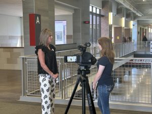 Morgan Gideon interviews Dr. O'Bara for her advanced journalism newspaper course assignment. Courtesy of Braswell Media