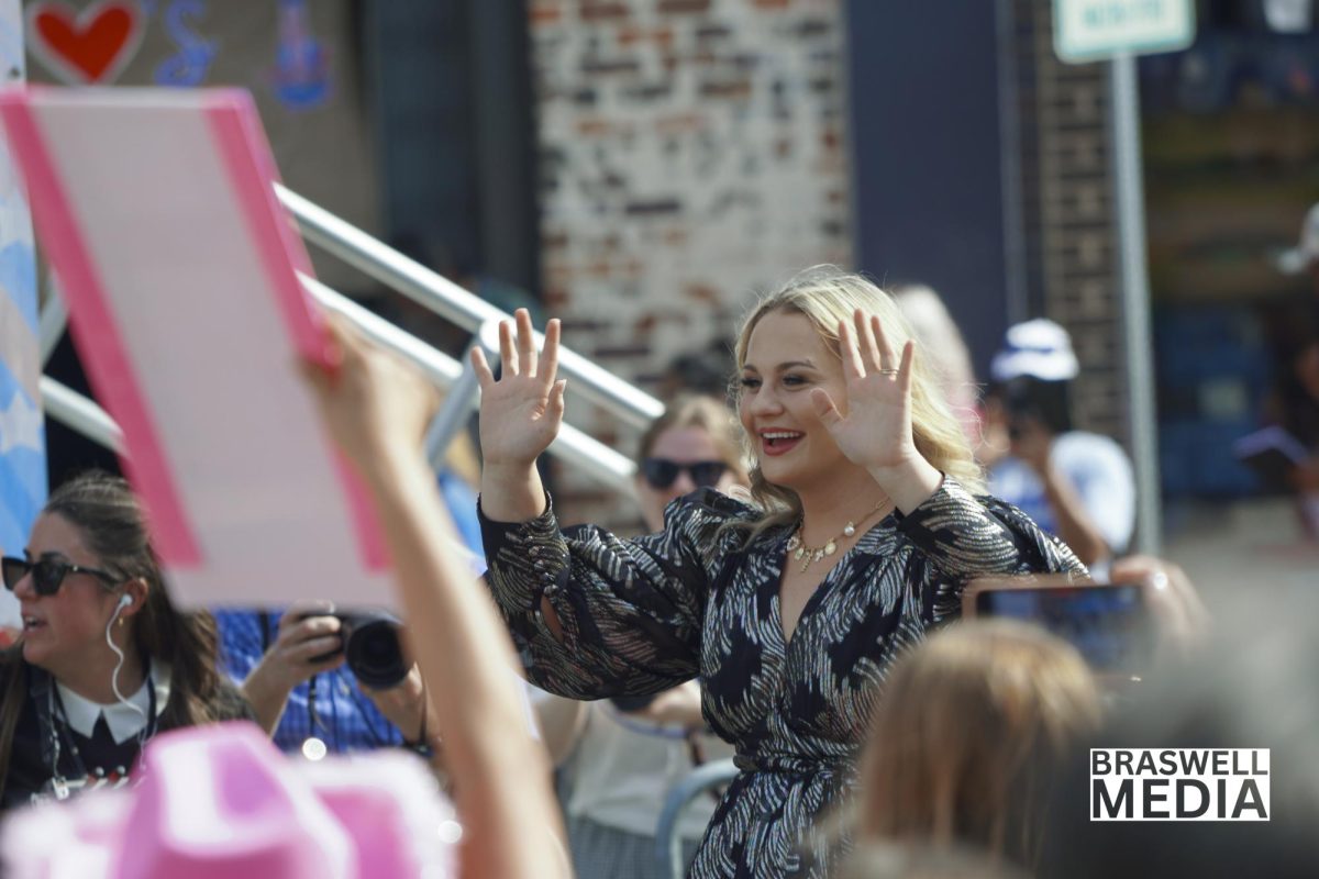25-year old Breanna Nix waves to fans while riding in a convertible through the Denton Square during her hometown parade on May 14. The celebration honored her Top 3 placement on American Idol and included performances, proclamations, and a key to the city. 