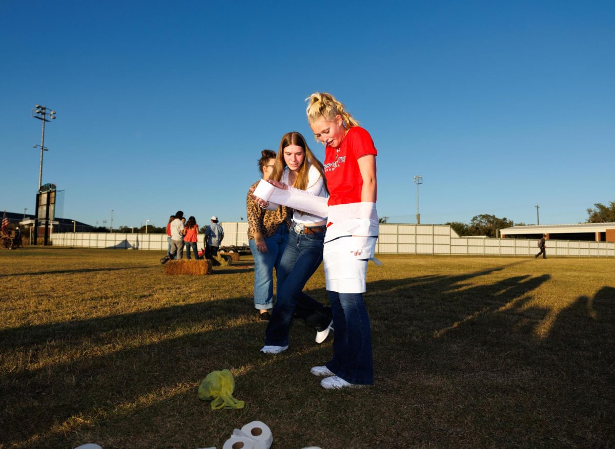 Midair Moments
Marleigh Jett, 12, hops and tumbles alongside fellow Braswell FFA members during a lively potato sack race at an Ag Olympics event with FFA organizations from all four high schools hosted at Ryan High School on Oct. 21. "I didn’t end up winning, and I did fall, but it didn’t hurt at all," Jett said. "I somehow felt more accomplished when I fell," Jett said. "I was a bit nervous because jumping in front of everyone was a little weird but once I was out there it was fine, I had so much fun."
Photo Courtesy of Denton ISD Communications