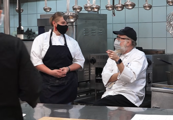 Chef Paul Niles speaks with Meghan Gill after her appearance on Hell's Kitchen at LaGrone Academy in 2021. Photo Courtesy of Denton ISD